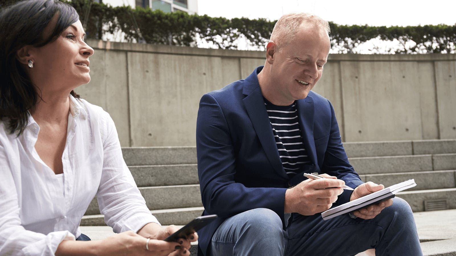 individuals having conversation in an outside setting