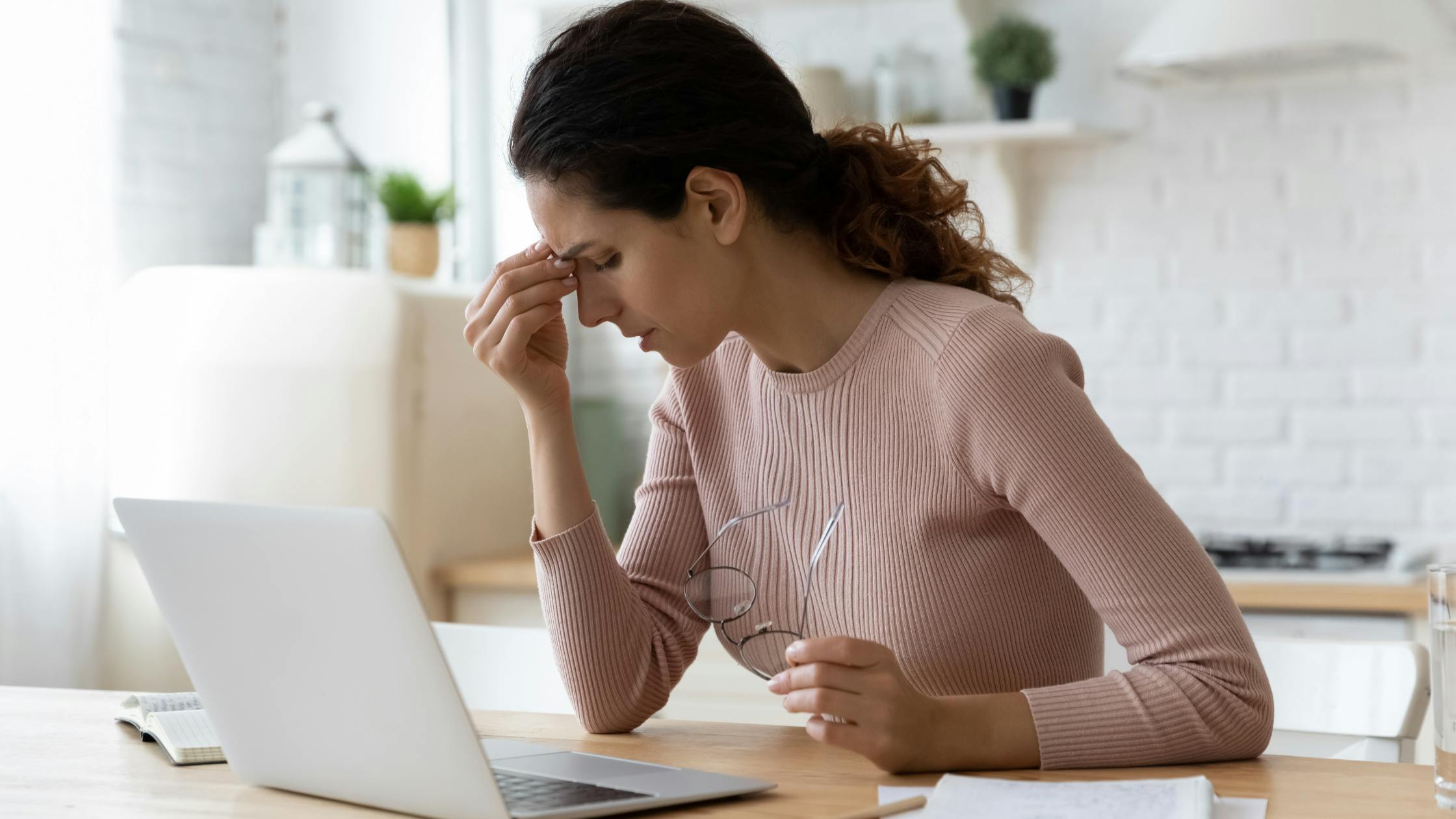 Woman experiencing imposter syndrome struggling with her work