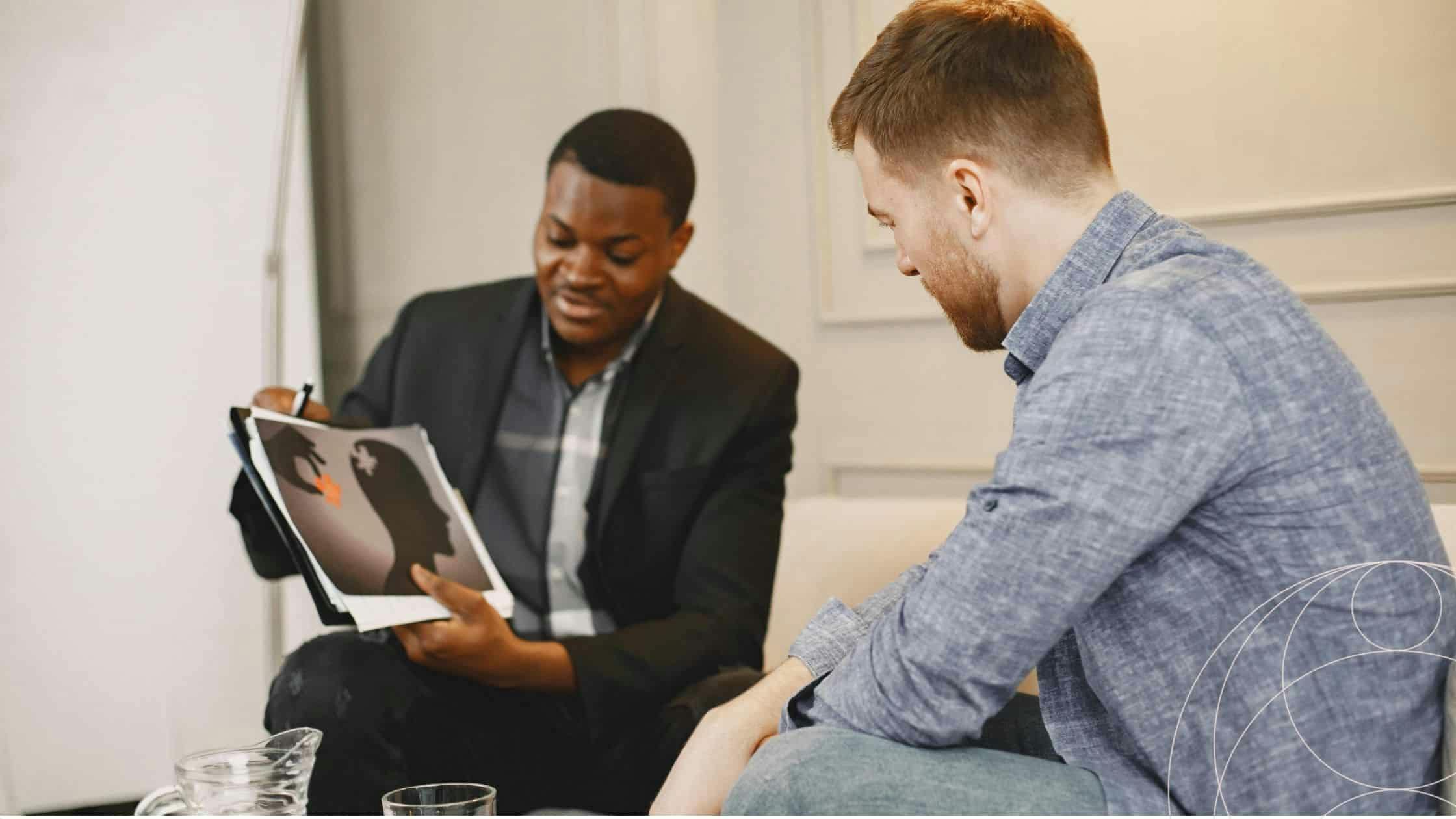 Executive coaching chemistry session between coach and client discussing leadership development goals