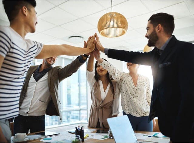 employees giving each other a high five