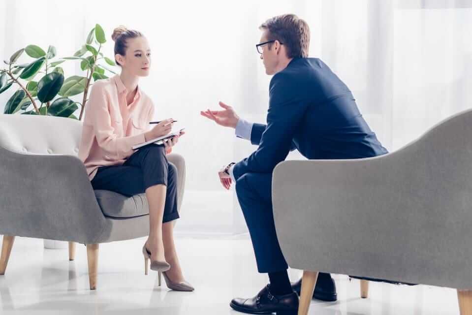 woman listening to a man while he was talking