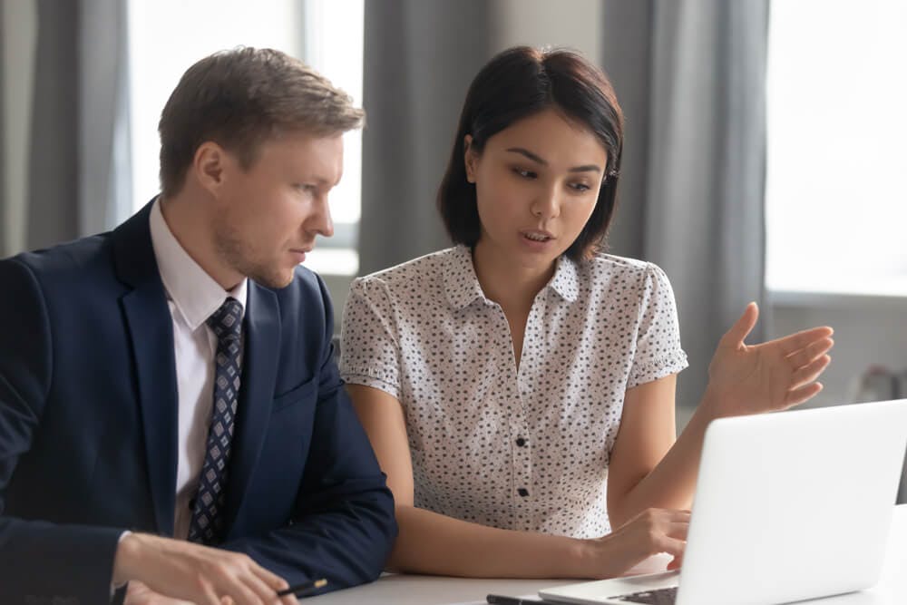 female career coach talking to male coachee