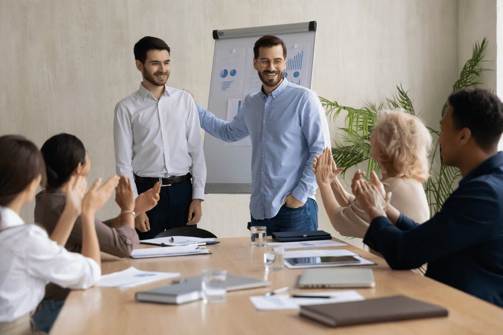 Business leader introduce the newly promoted employee to the team