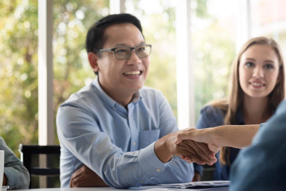 male professional shaking hands