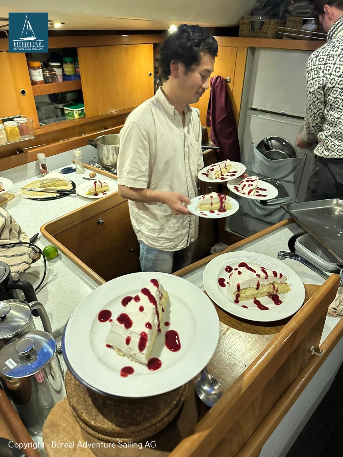 Ski & Sail, Lyngen Alps: chef plating desserts in the yacht's galley
