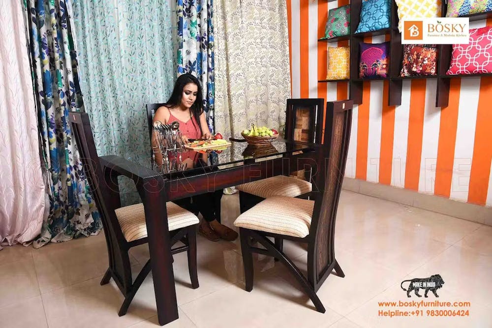 Woman having food on a solid wood table chairs
