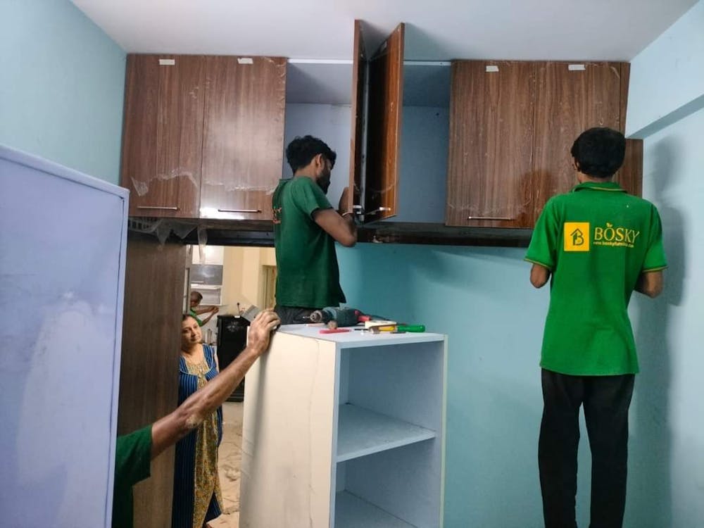 Carpenters making a wardrobe