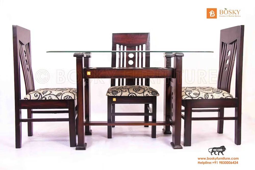 Photo of a complete dining table set with three chairs
