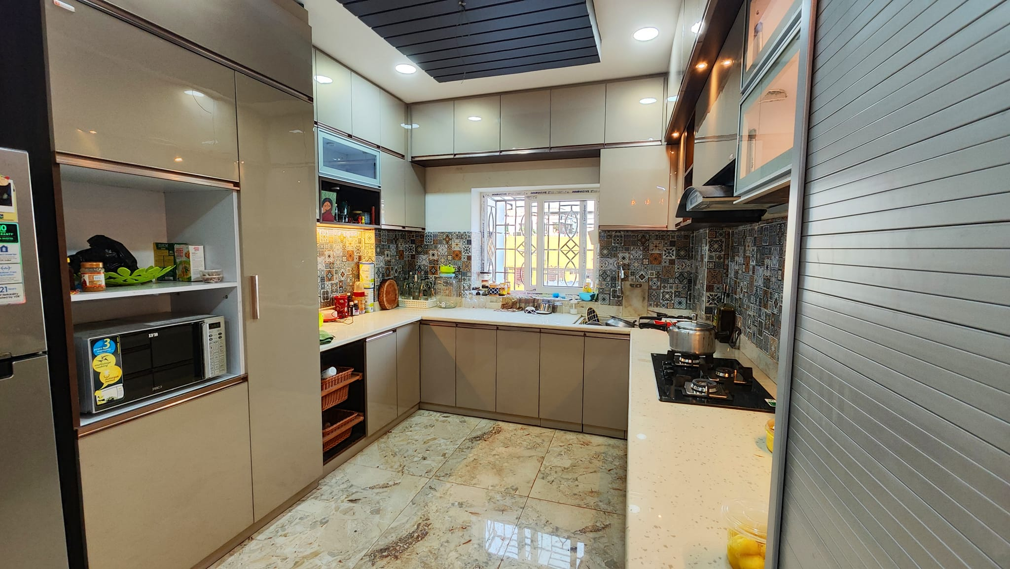 Beige modular kitchen with two countertops