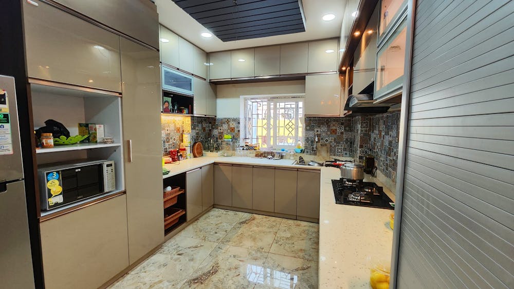 Beige modular kitchen with two countertops