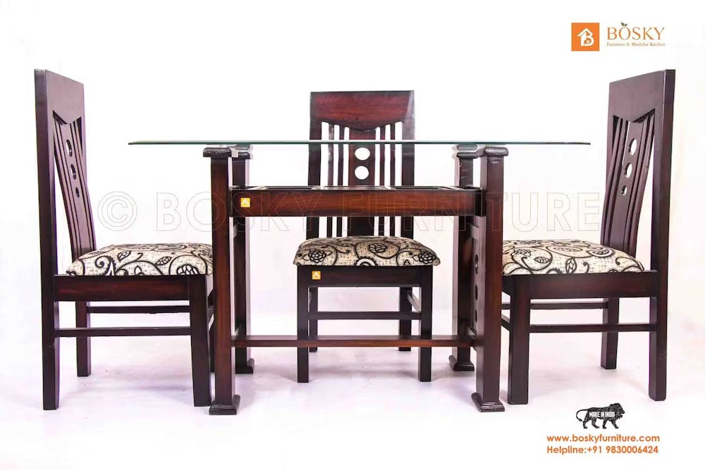A dining table with four chairs by Bosky furnitures pic