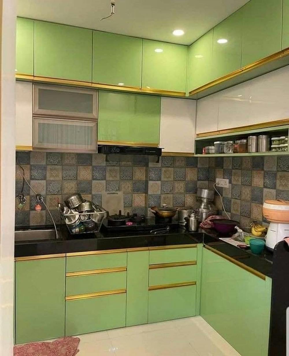 Green L shape kitchen interior