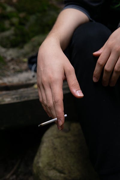 Hand holding cigarette