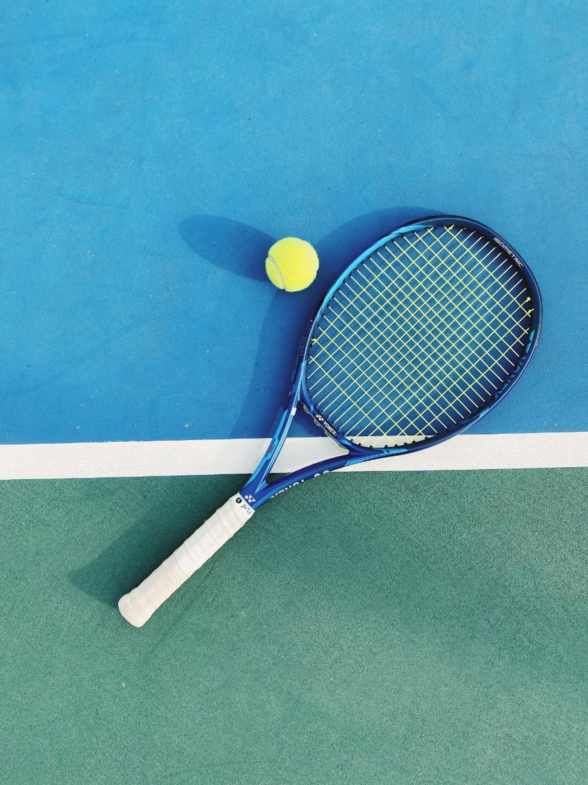 A tennis rocket lying on the ground