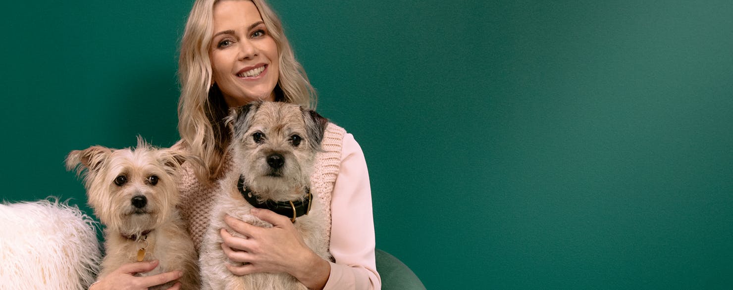 Kate Lawler holding her two dogs