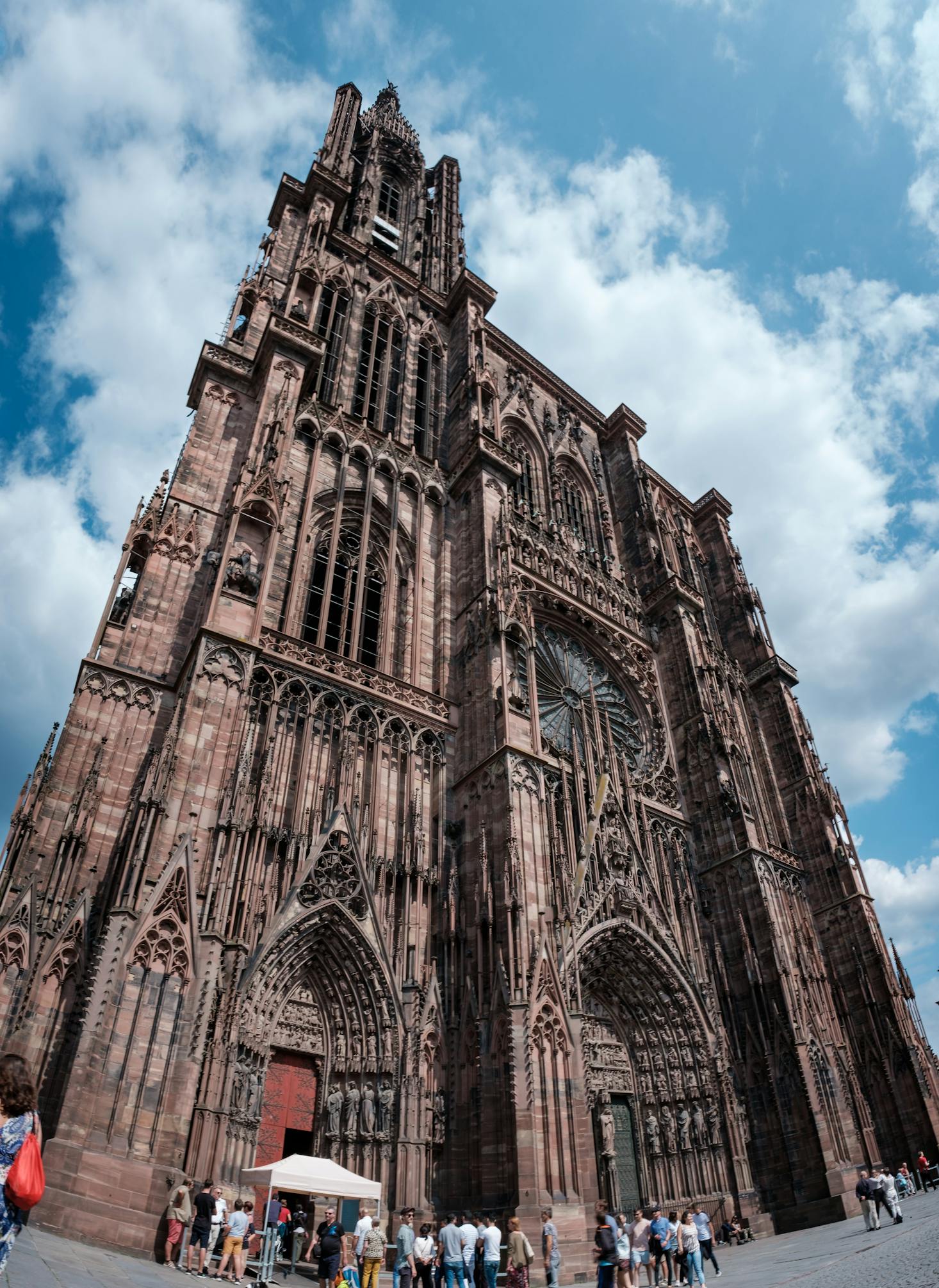 The ancient Strasbourg Cathedral towers high against a blue sky