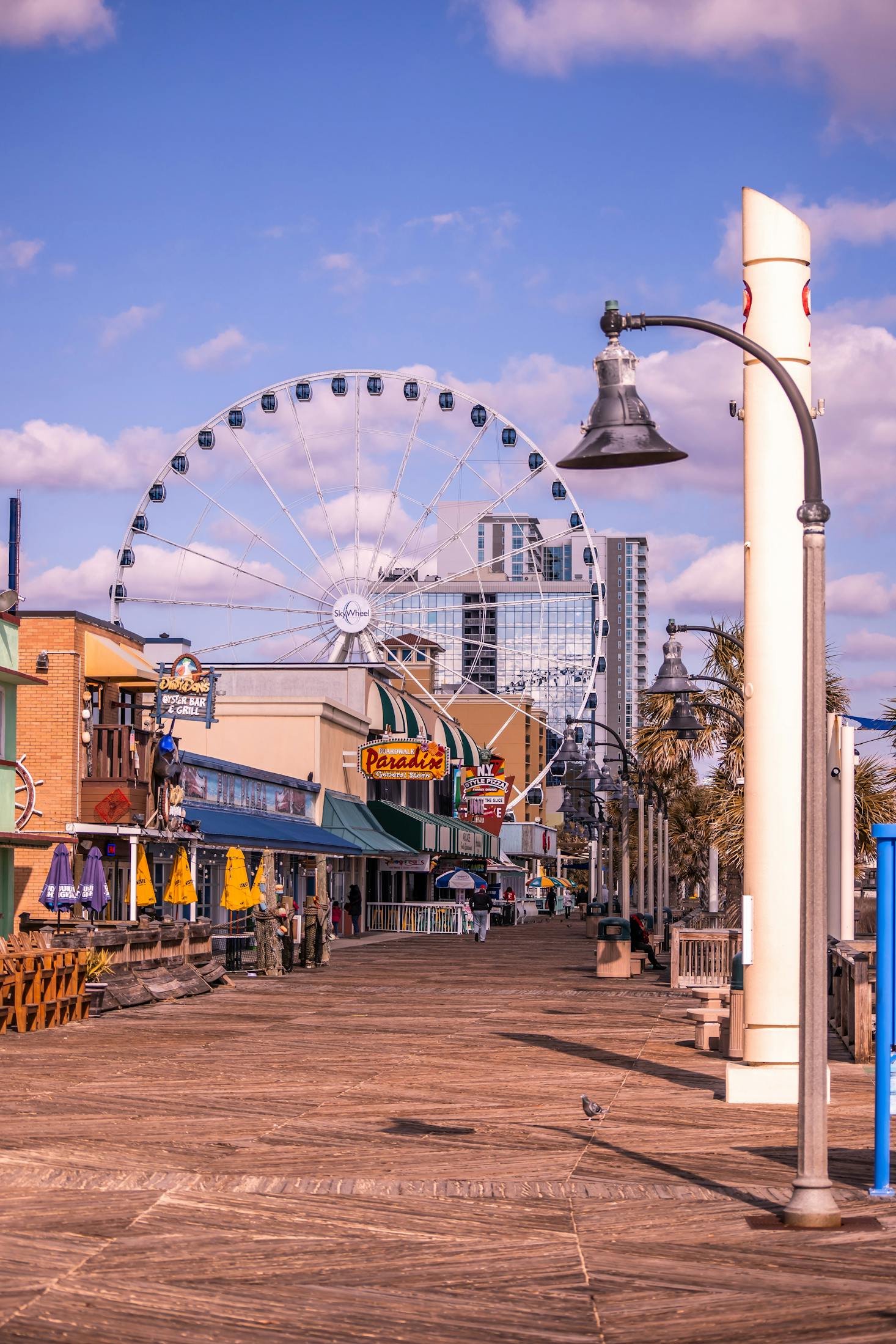 The Boardwalk in Myrtle Beach with a Ferris wheel 