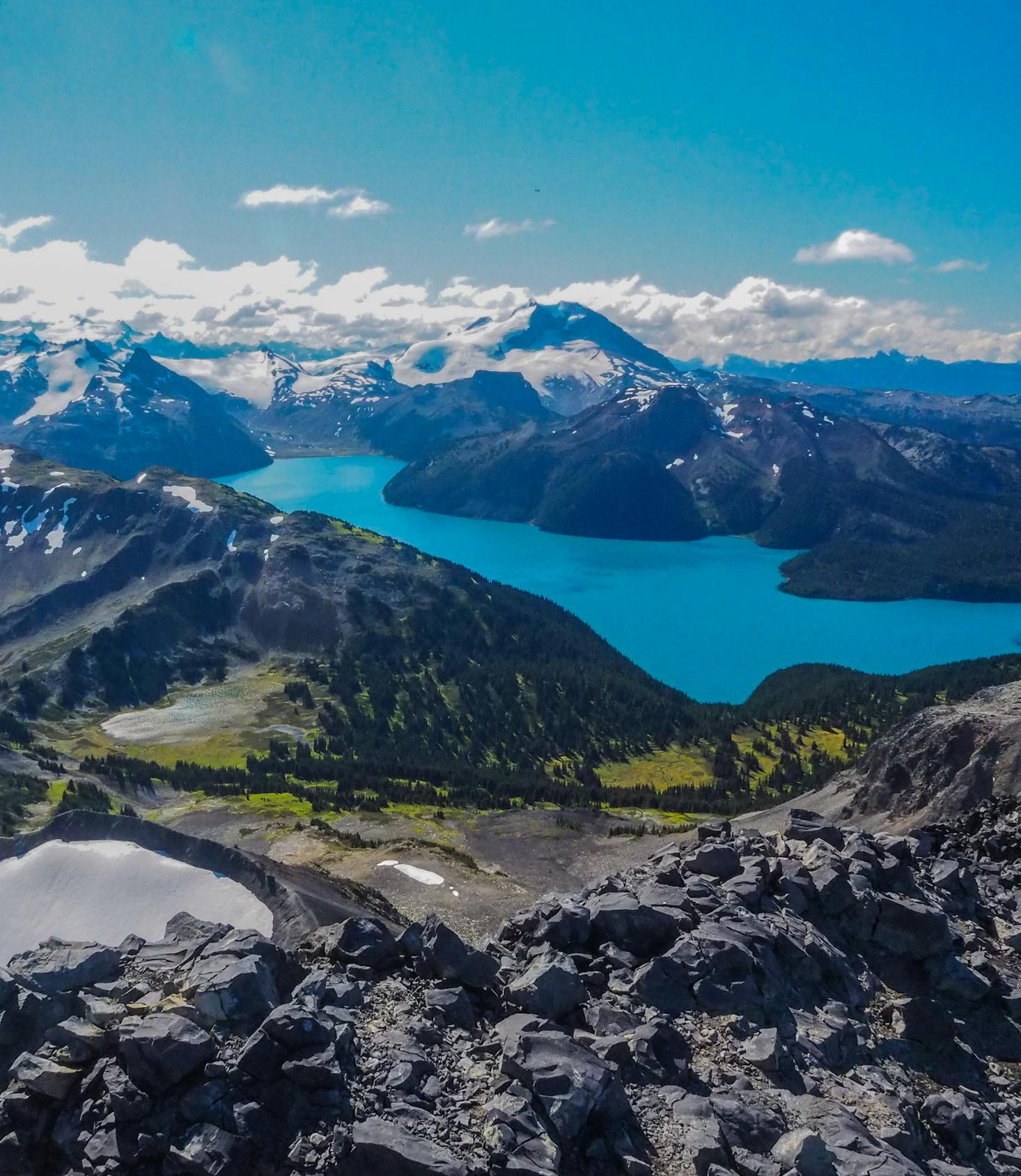 An alpine late with bright blue water in the mountains near Whistler, BC