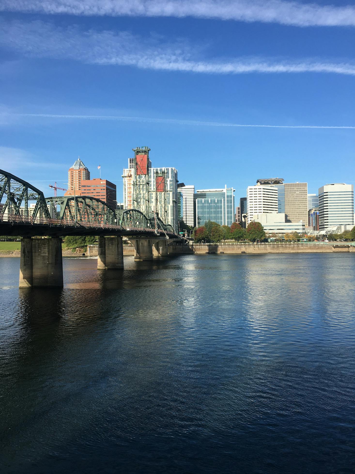 The waterfront in Portland with tall buildings in the distance