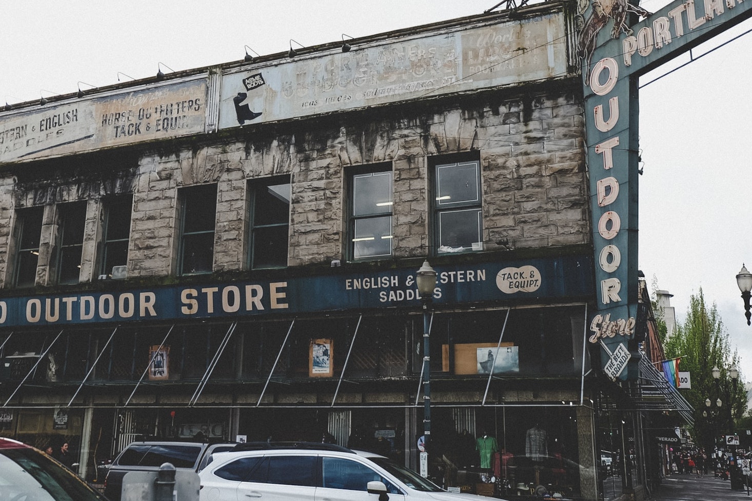 Busy street in Portland with cars passing by and the old Portland Outdoor Store building