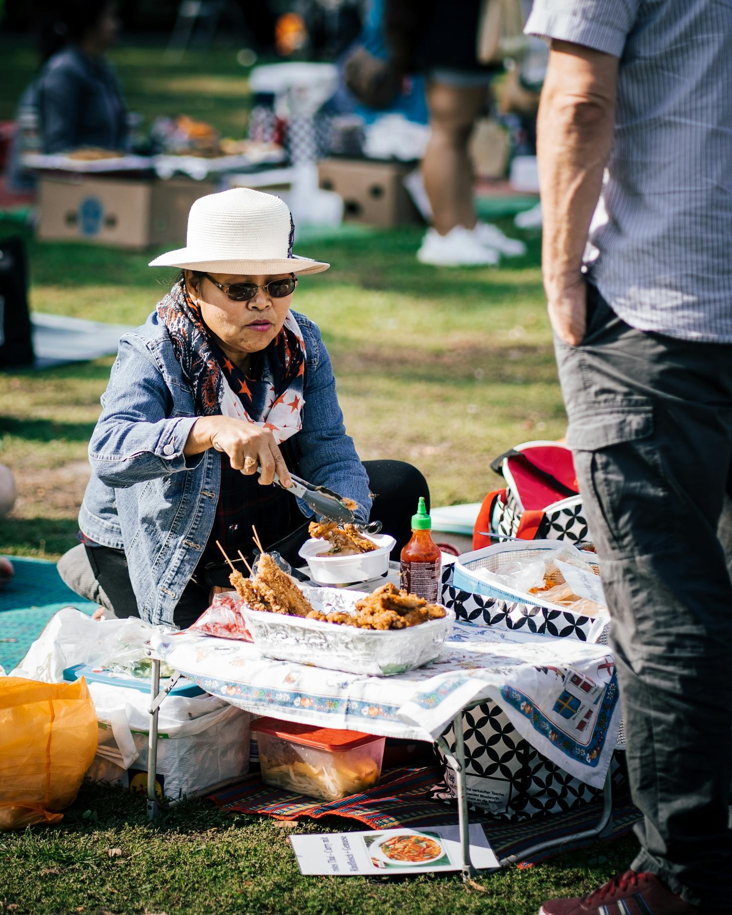 Woman cooking in Thai Park, Berlin