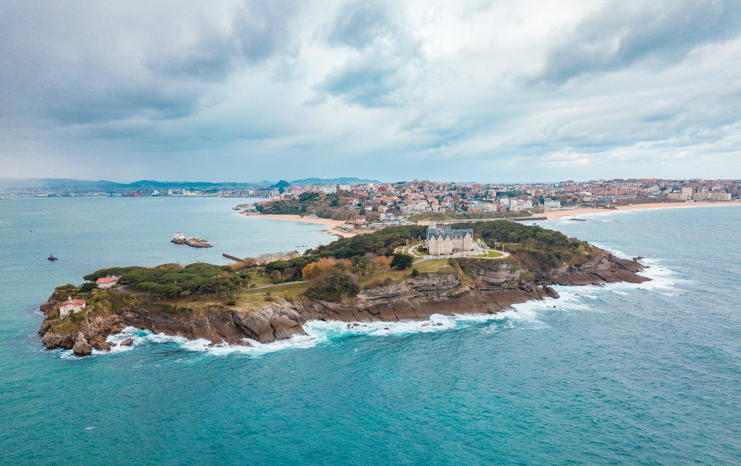 The Cantabrian Sea surrounds a green peninsula off Santander, Spain