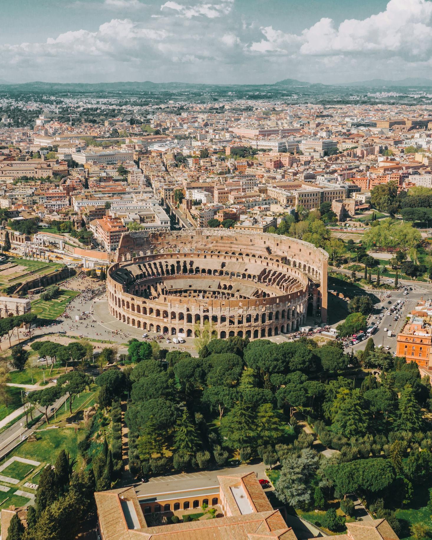 Aerial view of the Colosseum in Rome with Tiburtina Bus Station a train ride away