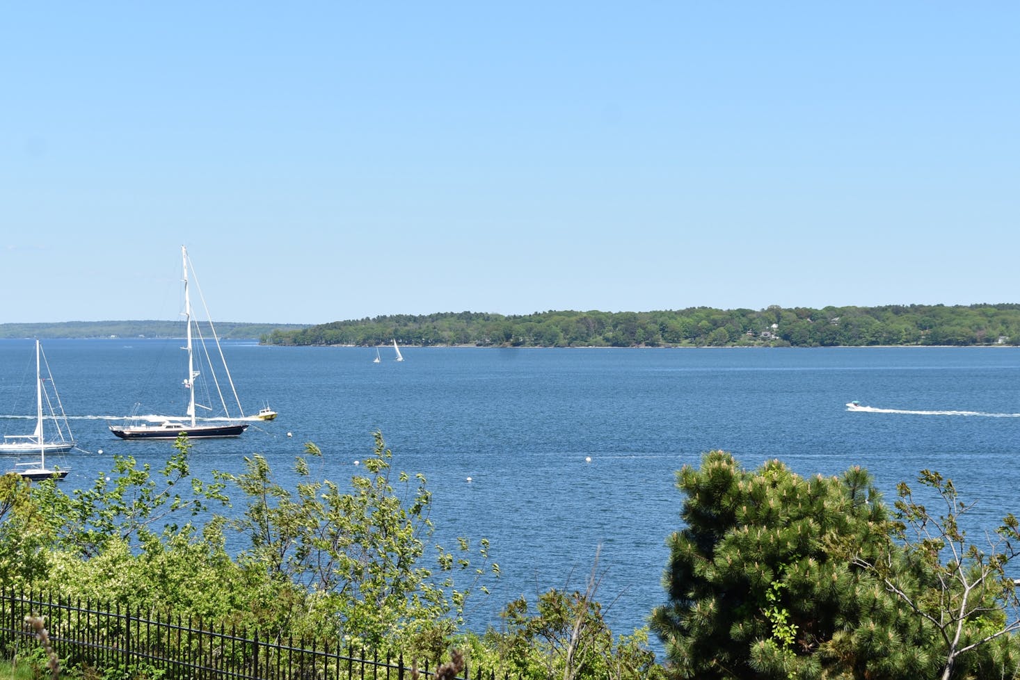 Boats against a clear blue sky in the Gulf of Maine in Portland, Maine