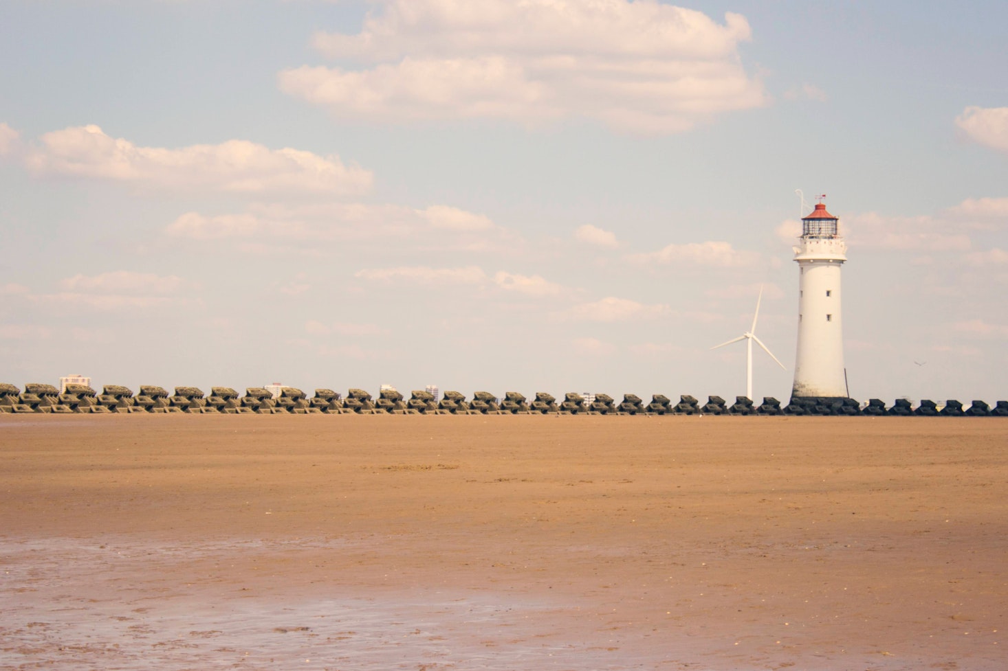 Sandy New Brighton Beach with the lighthouse in the background