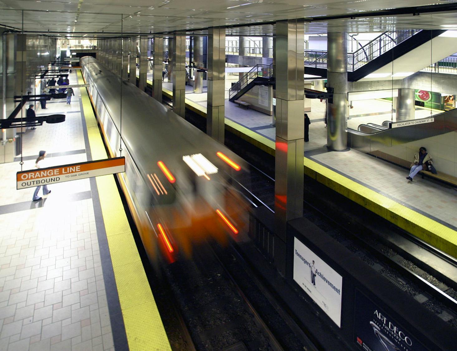 Platform with a fast-moving train at Boston North Station