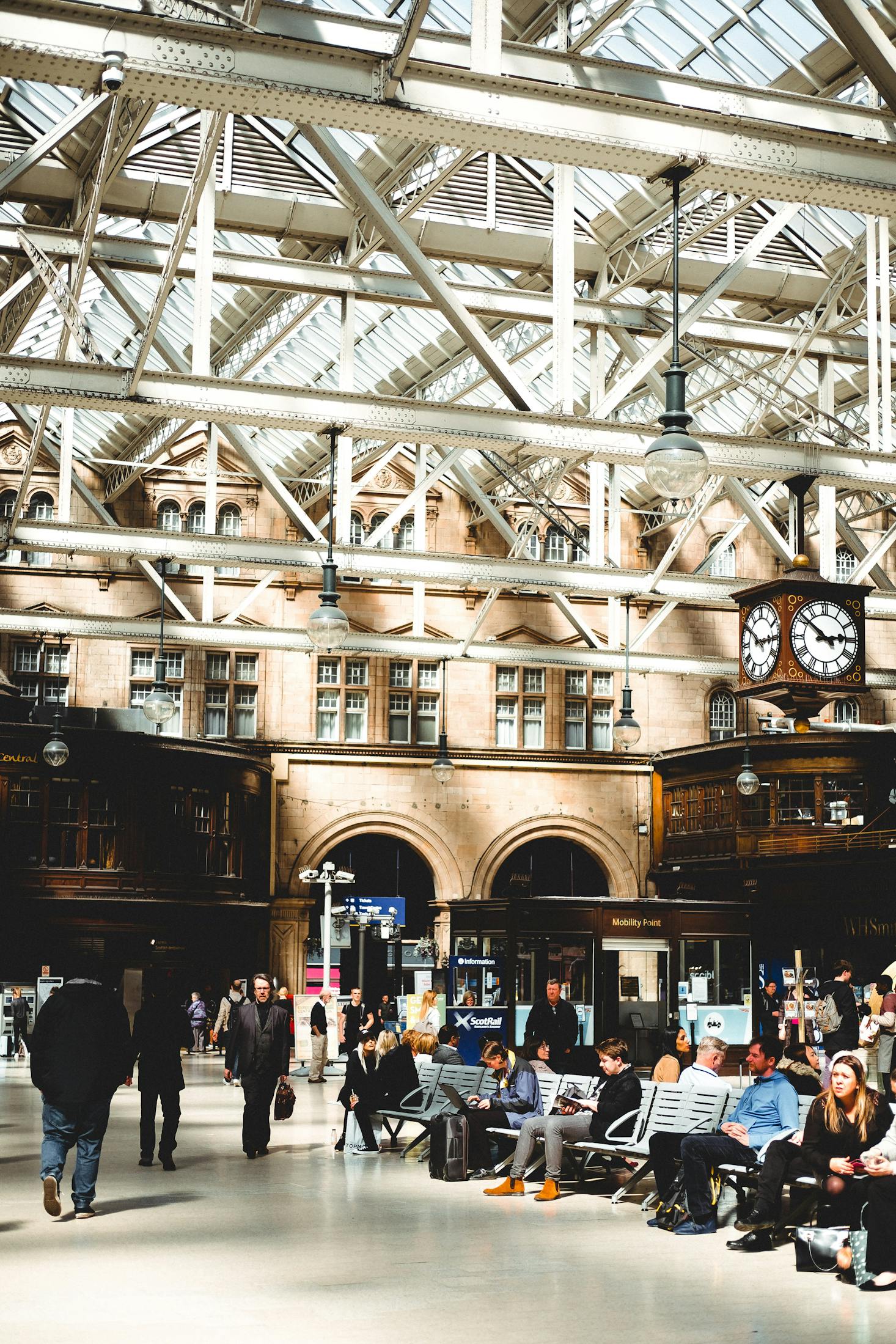 The interior of Glasgow Central Station with a prominent clock tower