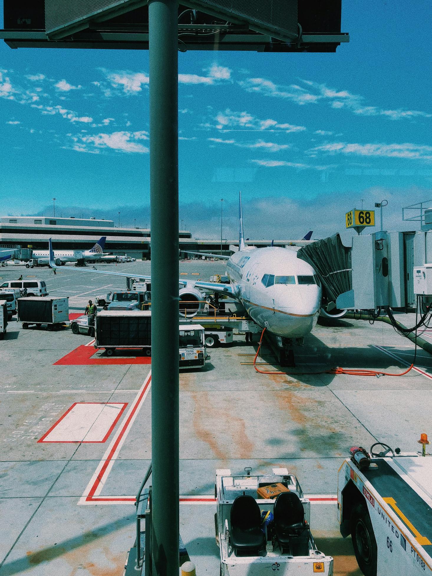 Looking out the window at a plane parked at a gate at San Francisco Airport