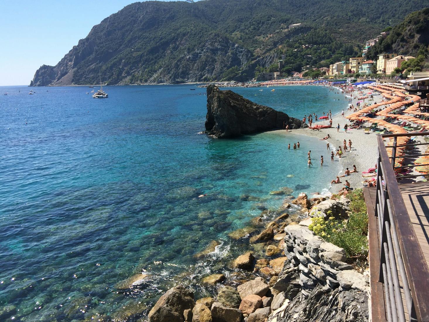 The clear water of the rocky coastline and mountains in Monterosso, Italy