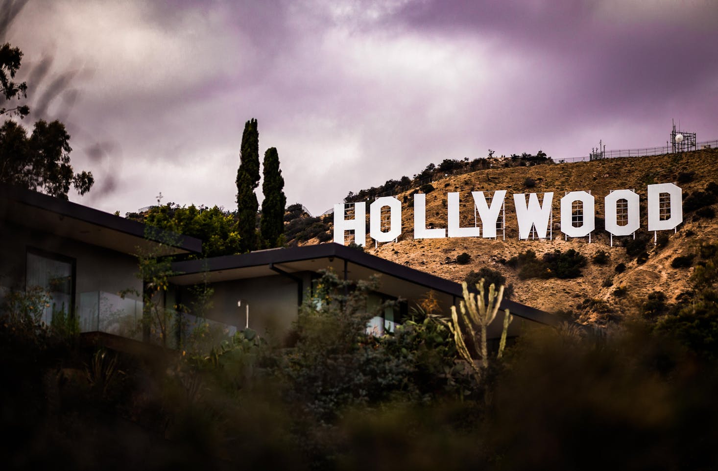 The famous white Hollywood sign in the hills above Los Angeles on a stormy day