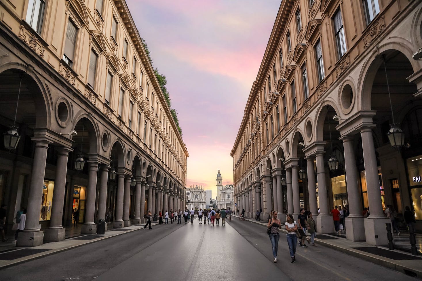 A deserted shopping street at sunset in Turin