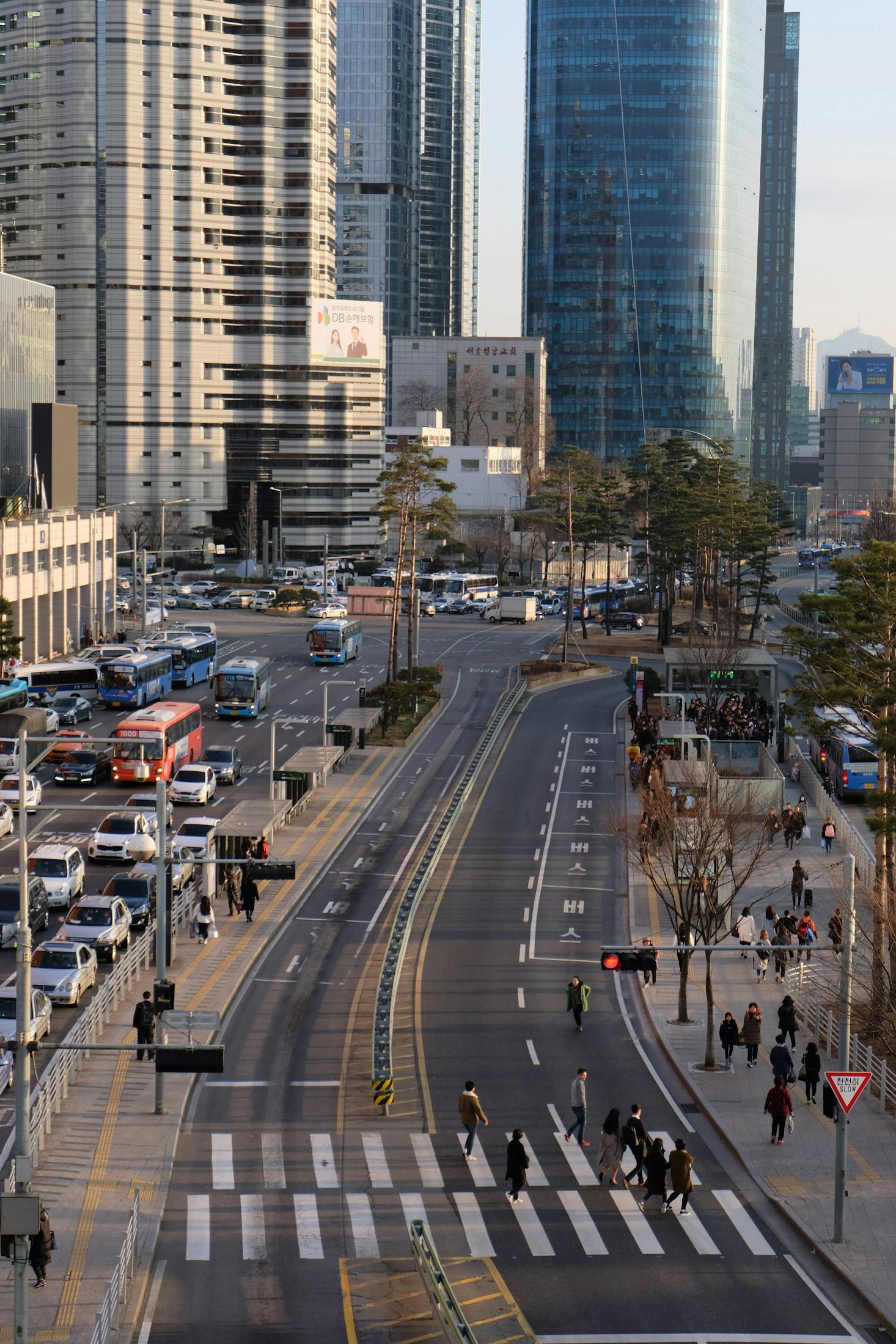 Traffic on a busy street with skyscrapers near Seoul Station