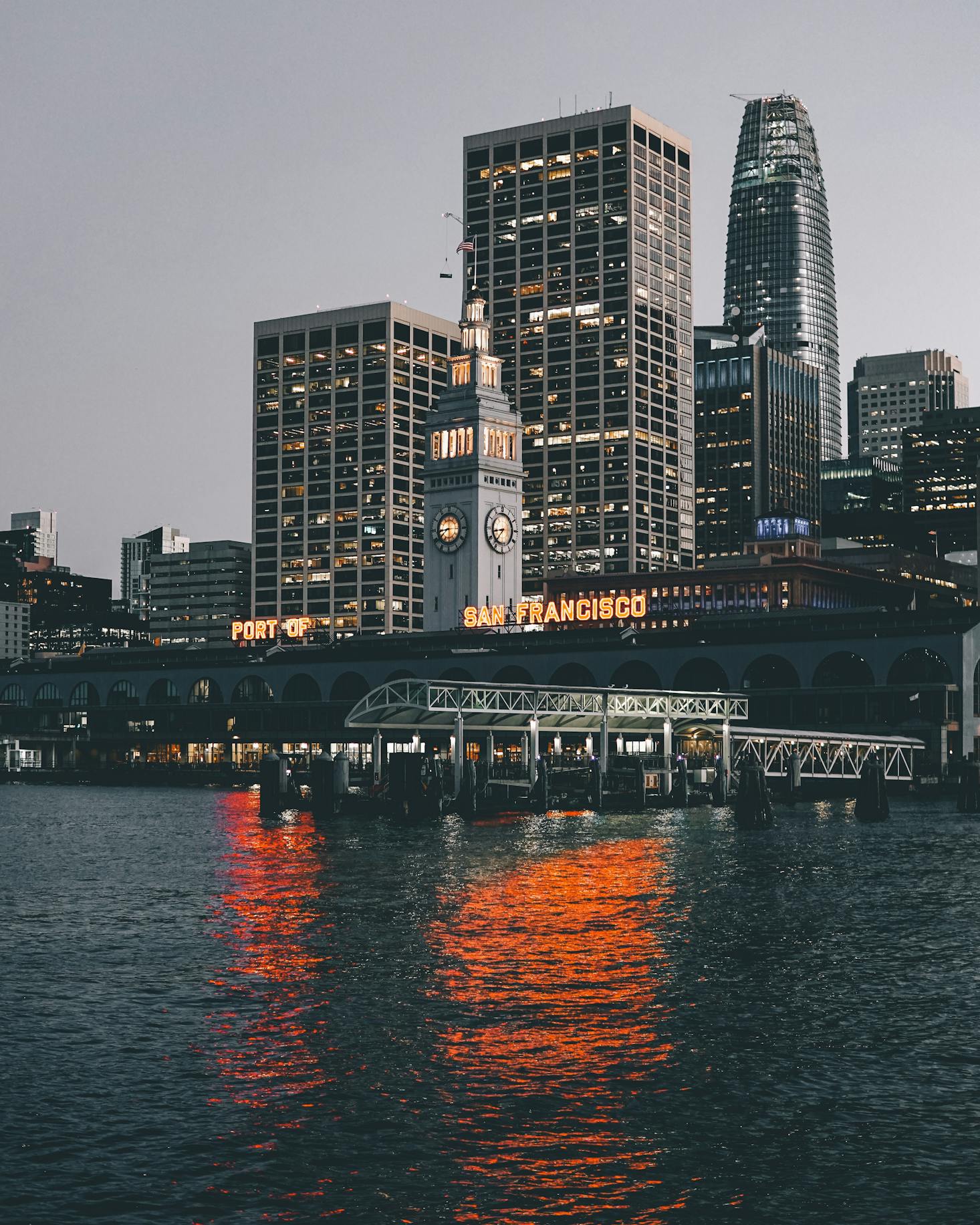 The San Francisco Ferry Building on the bay at dusk