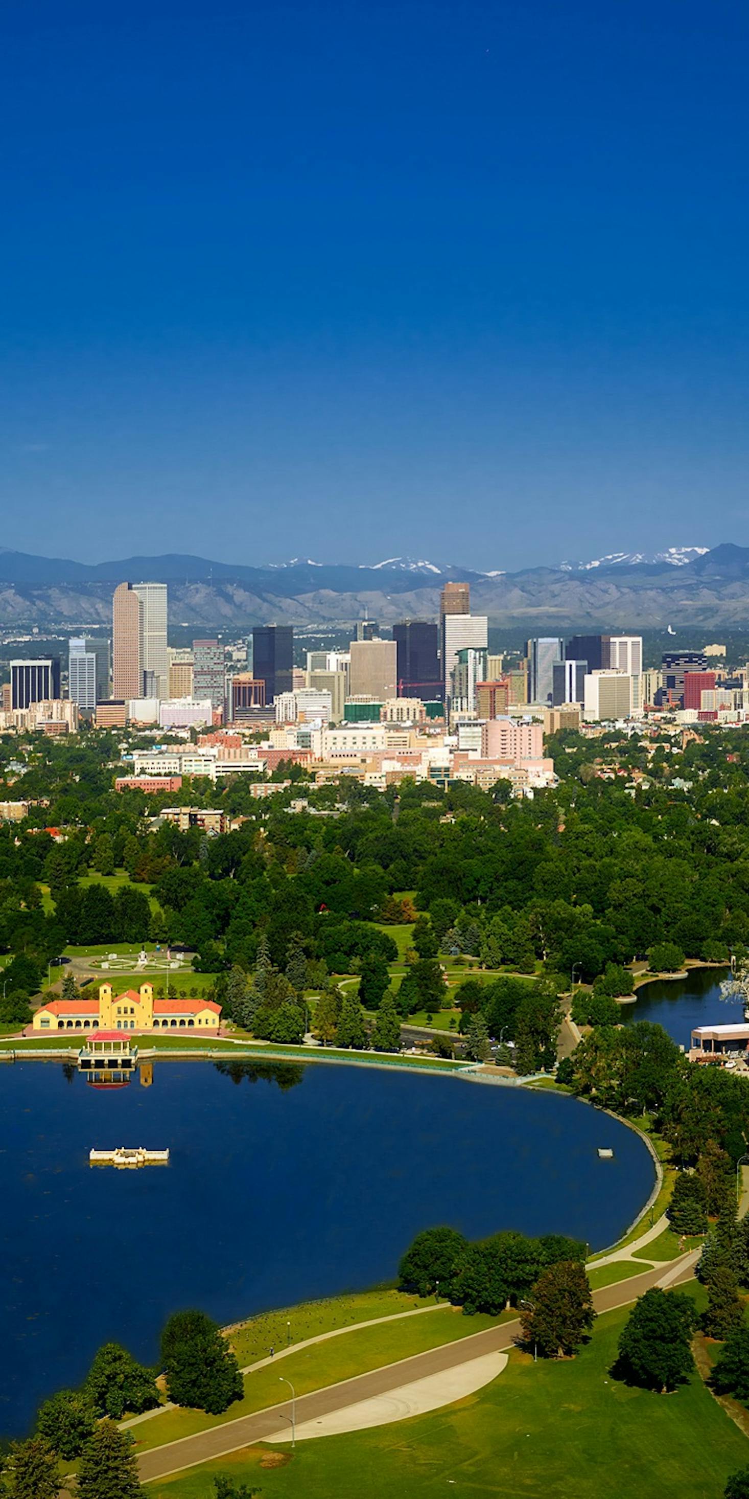 View of downtown Denver with snow-capped mountains in the distance