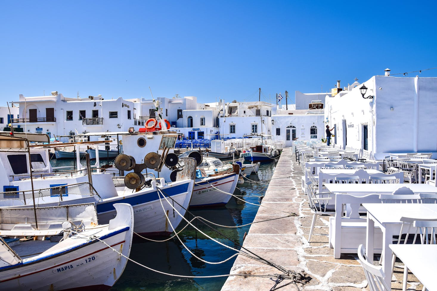 Boats and white buildings near Paros Port, Greece