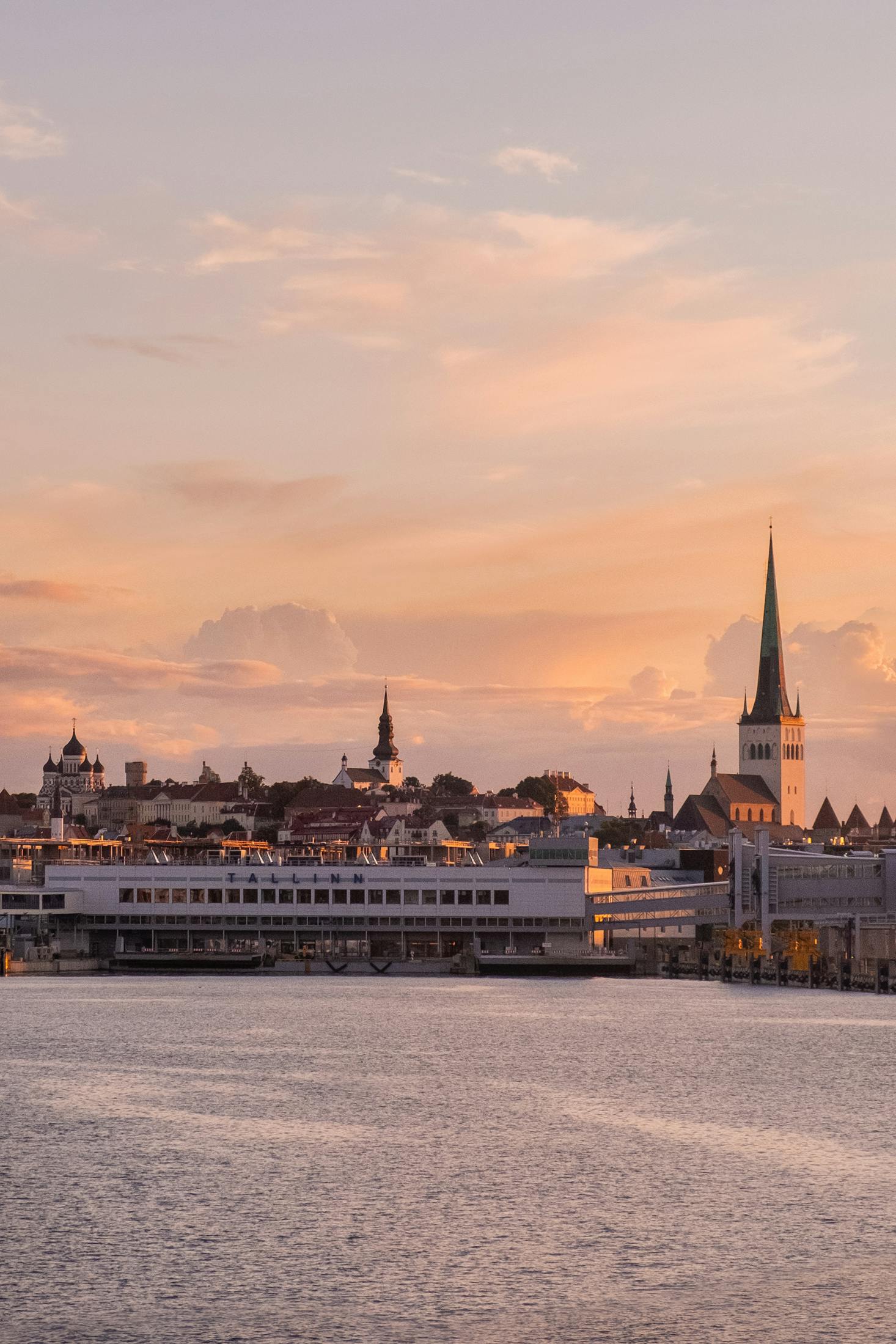 Buildings with tall spires dot the skyline in Tallinn, Estonia