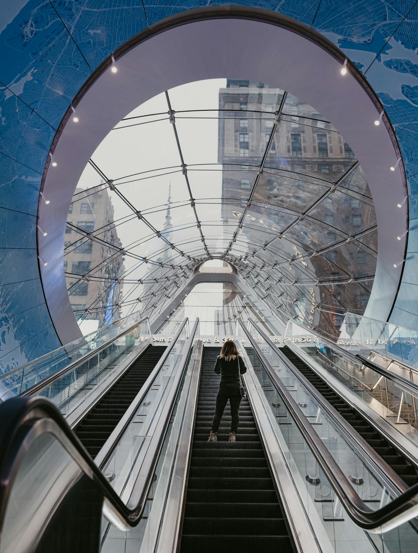 A large metal escalator at Penn Station in NYC