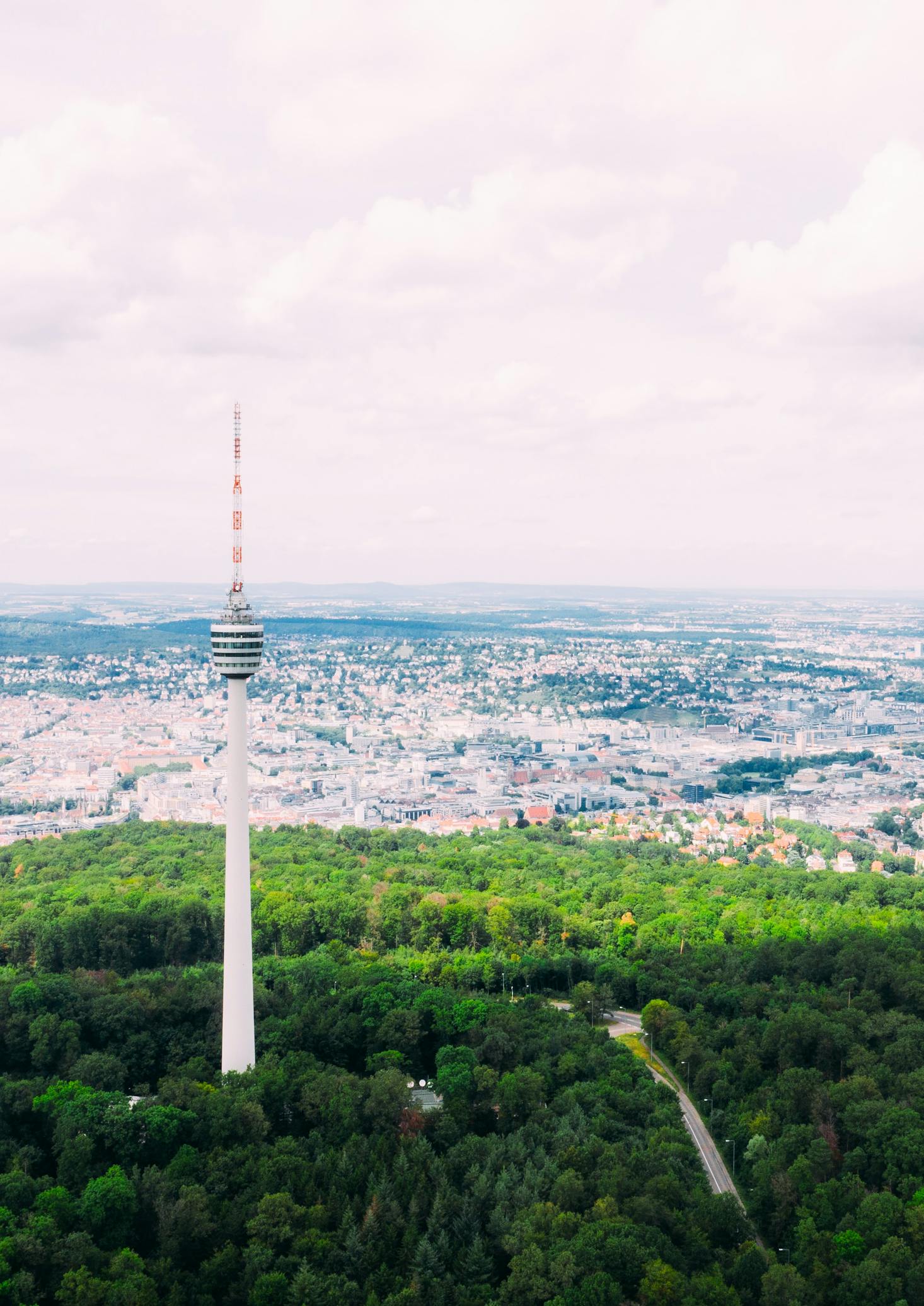 The tall TV Tower in Stuttgart, Germany towers over a green field