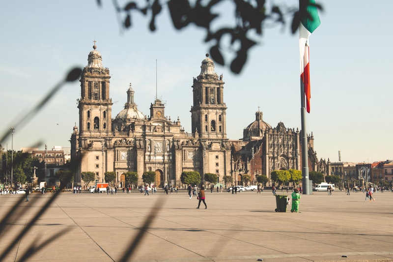 buildings and people in city square