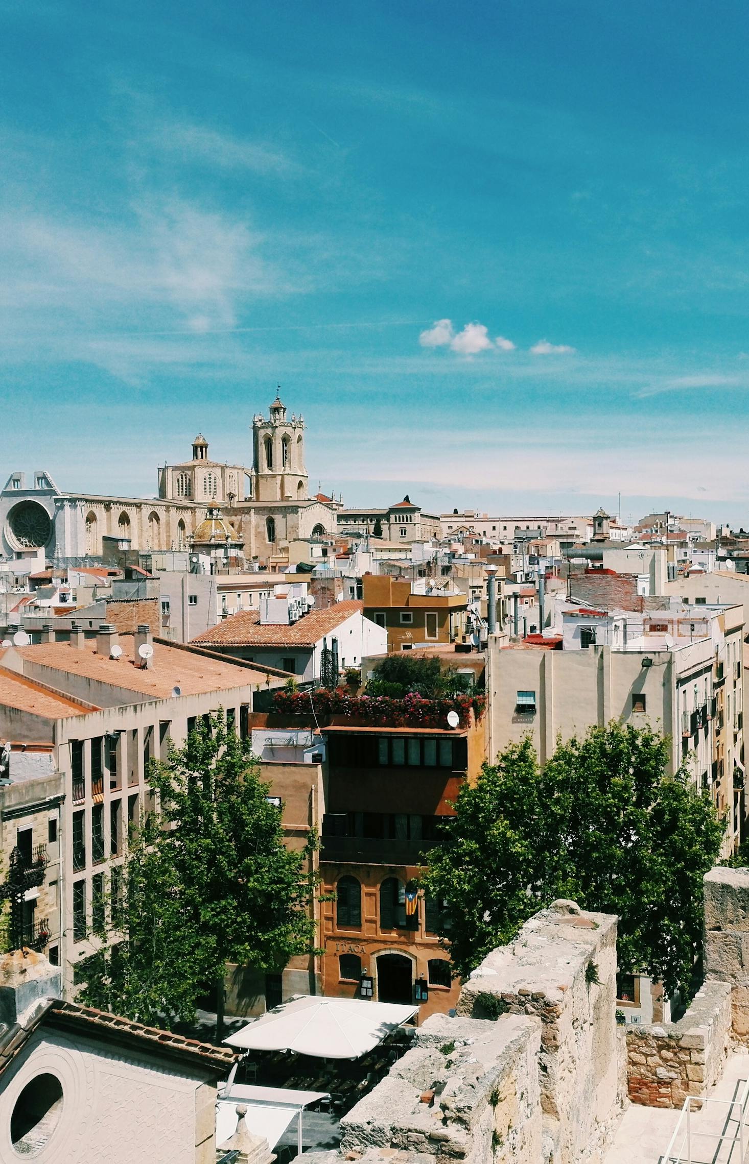 Ancient buildings and streets against a blue sky in Tarragona, Spain