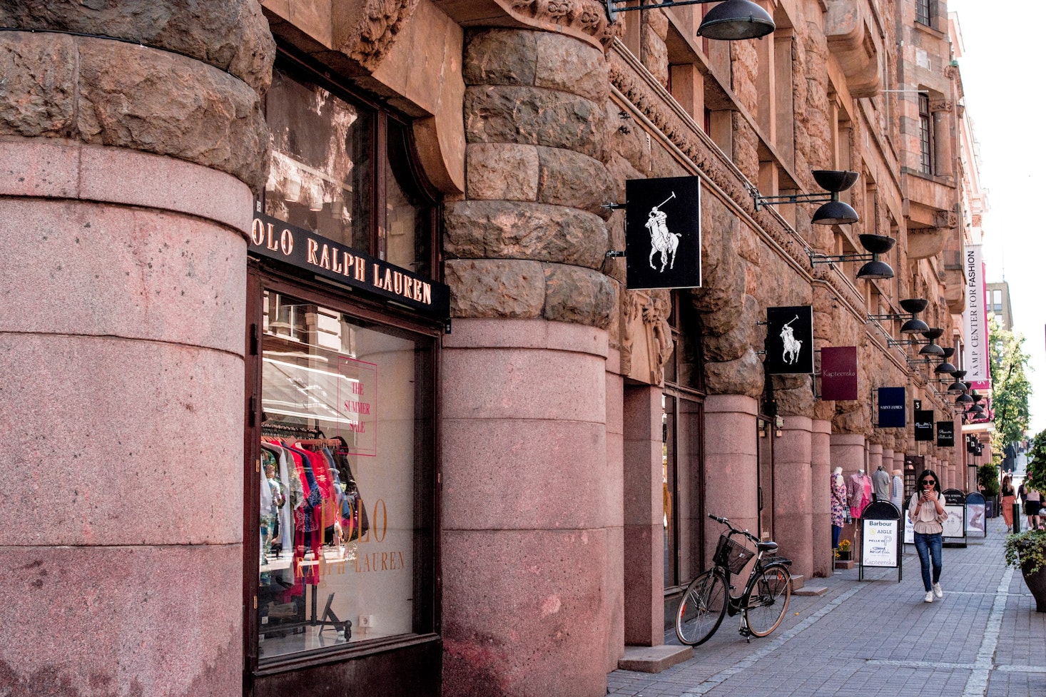 Aleksanterinkatu, a shopping street in Helsinki, featuring a Polo Ralph Lauren store and other trendy shops