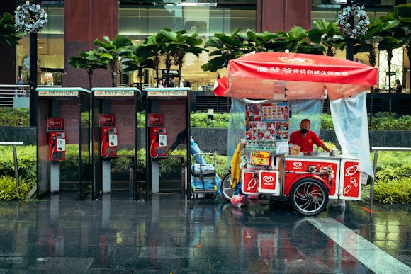 Singapore street food vendor on rainy day