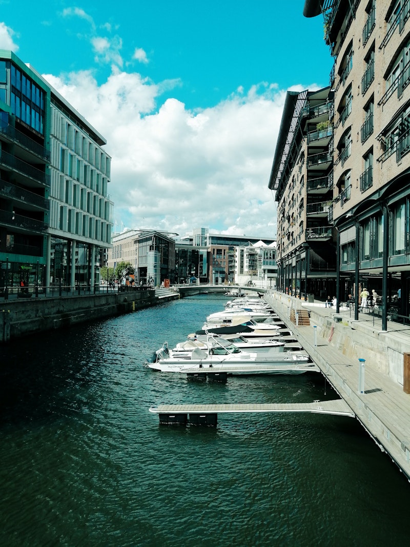 boats docked in front of buildings