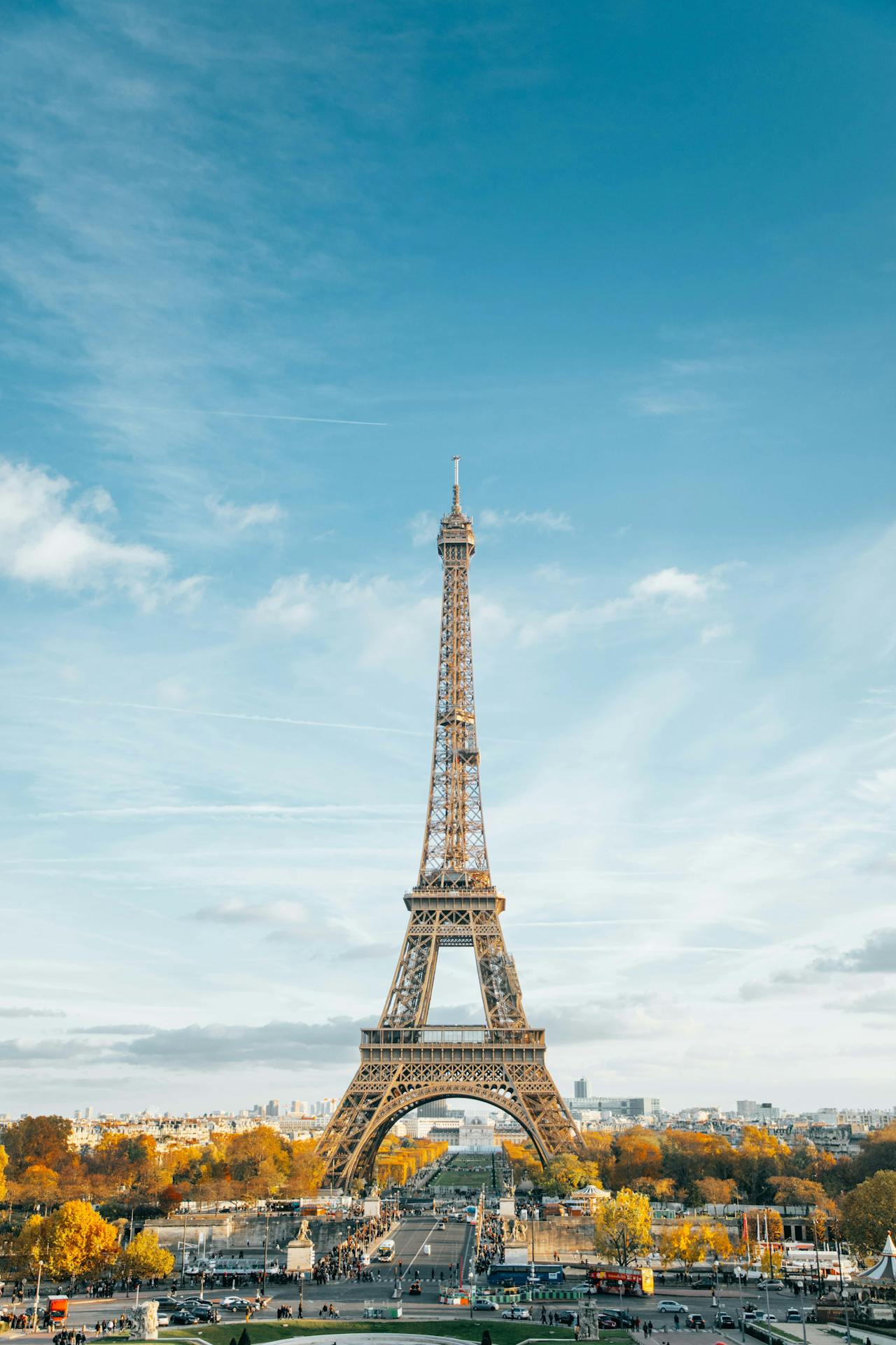 A distant view of the iron Eiffel Tower in Paris with nearby luggage storage