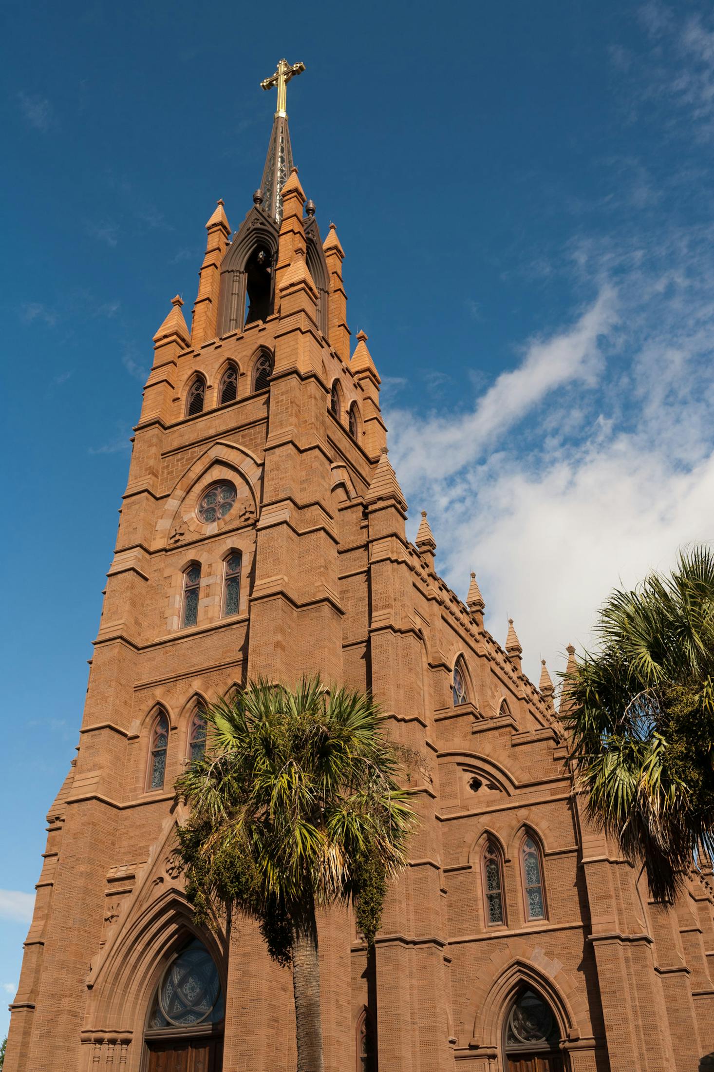 A majestic church with a cross reaches toward the sky in Charleston, South Carolina