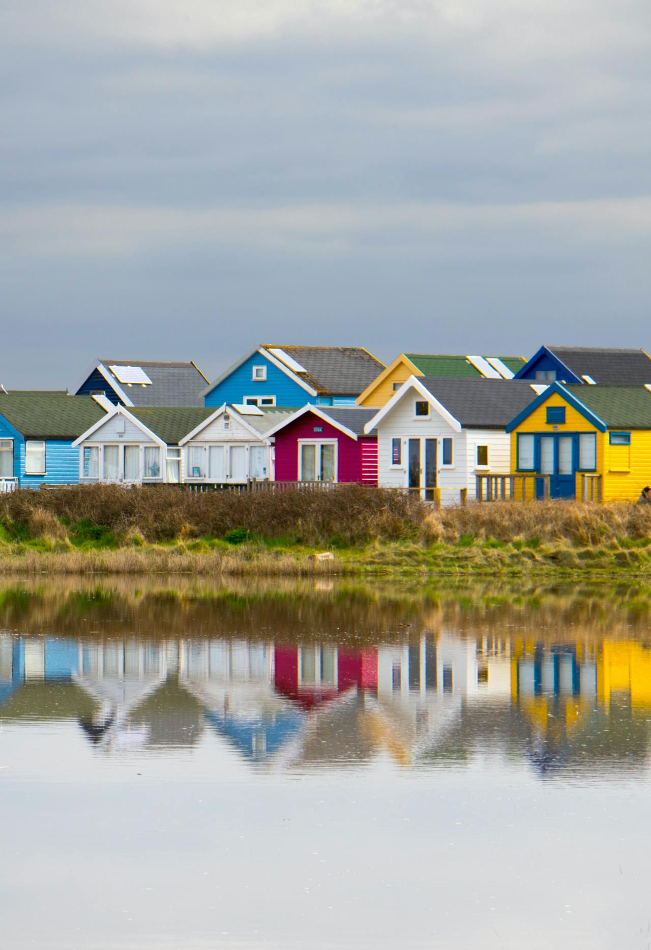 Colorful houses along the waterfront on a cloudy day in Bournemouth